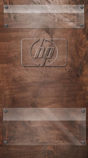 HP logo glass on wooden desk.jpg