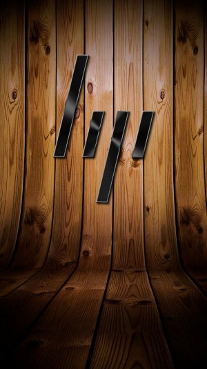 HP dark metal logo on wooden background.jpg