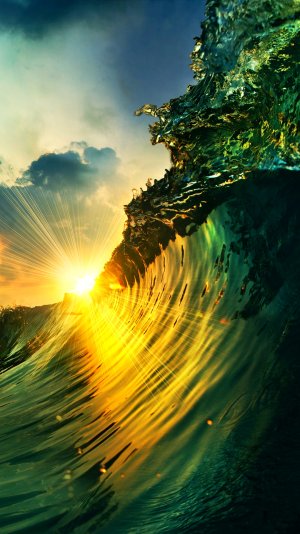 sunset_over_a_wave-wallpaper-10636520(1).jpg