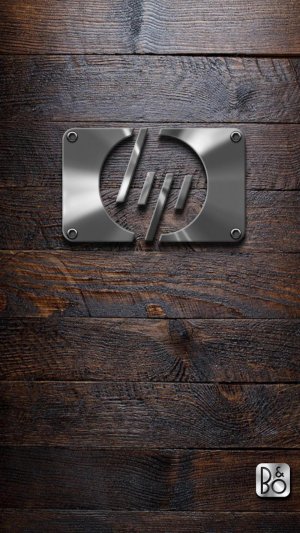 HP and B&O metal logo on old wooden background.jpg