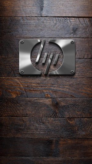 HP new metal logo on old wooden background.jpg